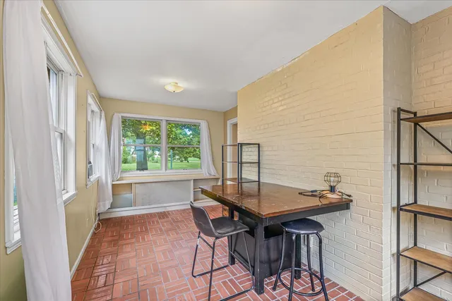 a workspace with furniture and window