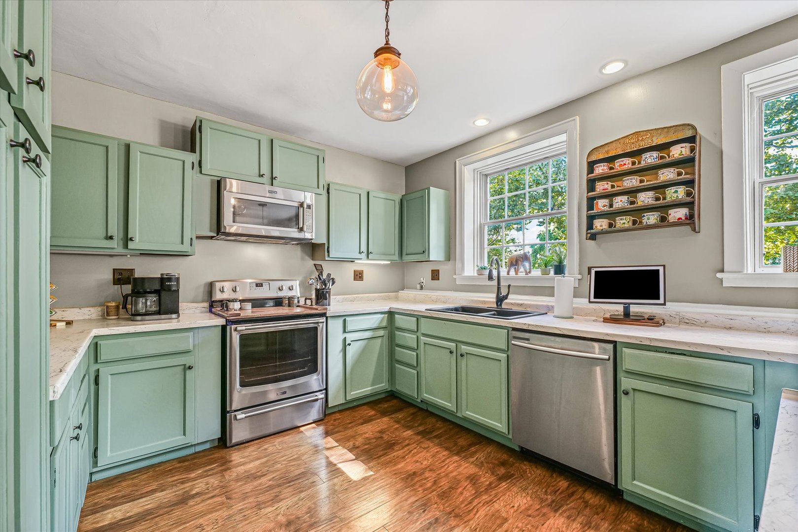 824 Arends Boulevard Rantoul, IL 61866 - Photo 15 of 38 a kitchen with stainless steel appliances granite countertop a sink and cabinets
