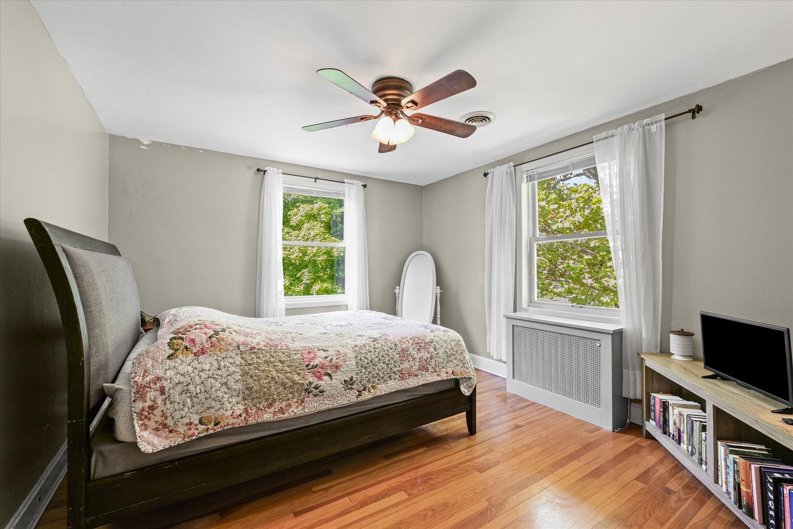 824 Arends Boulevard Rantoul, IL 61866 - Photo 18 of 38 a bedroom with a bed and a flat screen tv