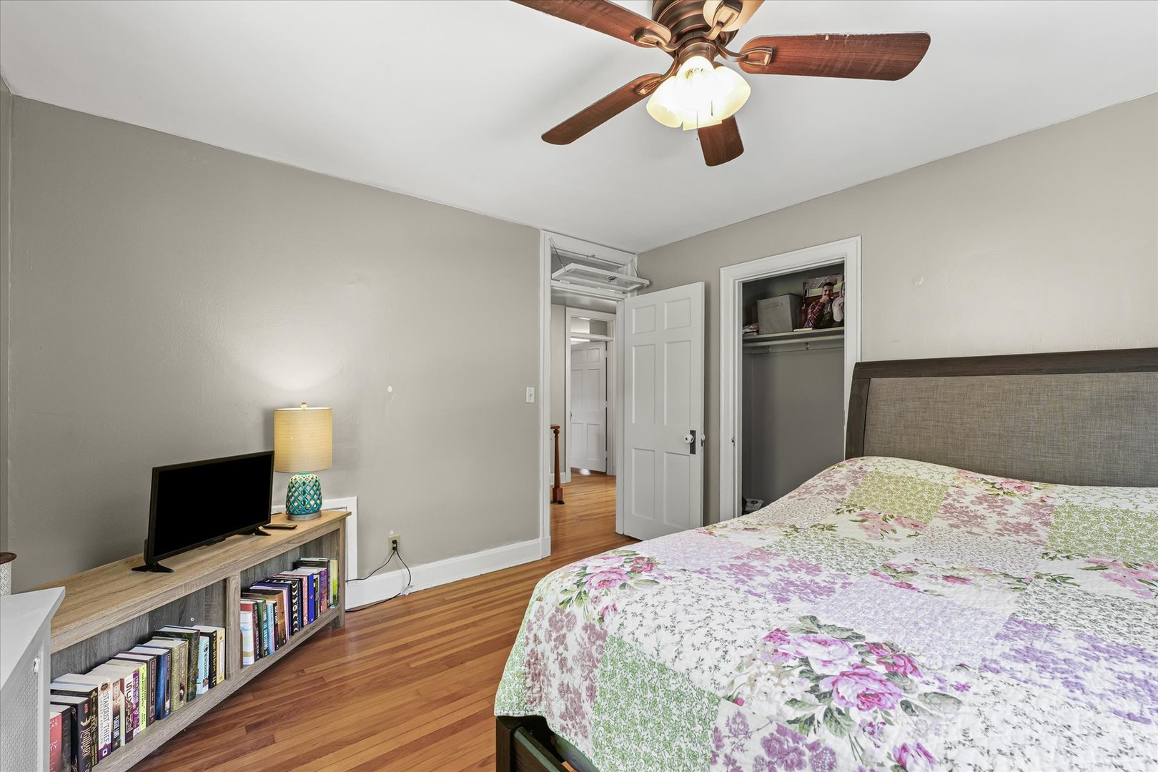 824 Arends Boulevard Rantoul, IL 61866 - Photo 19 of 38 a bedroom with a bed and a flat screen tv