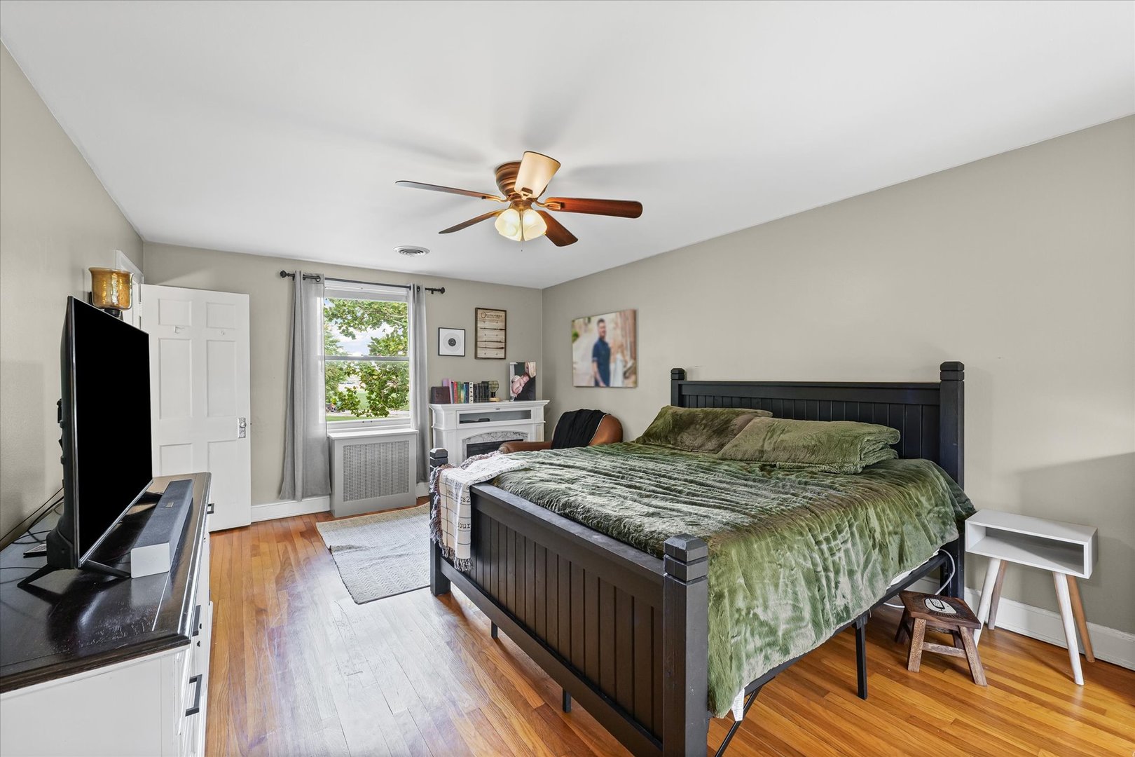 824 Arends Boulevard Rantoul, IL 61866 - Photo 23 of 38 a bedroom with a bed and a flat screen tv