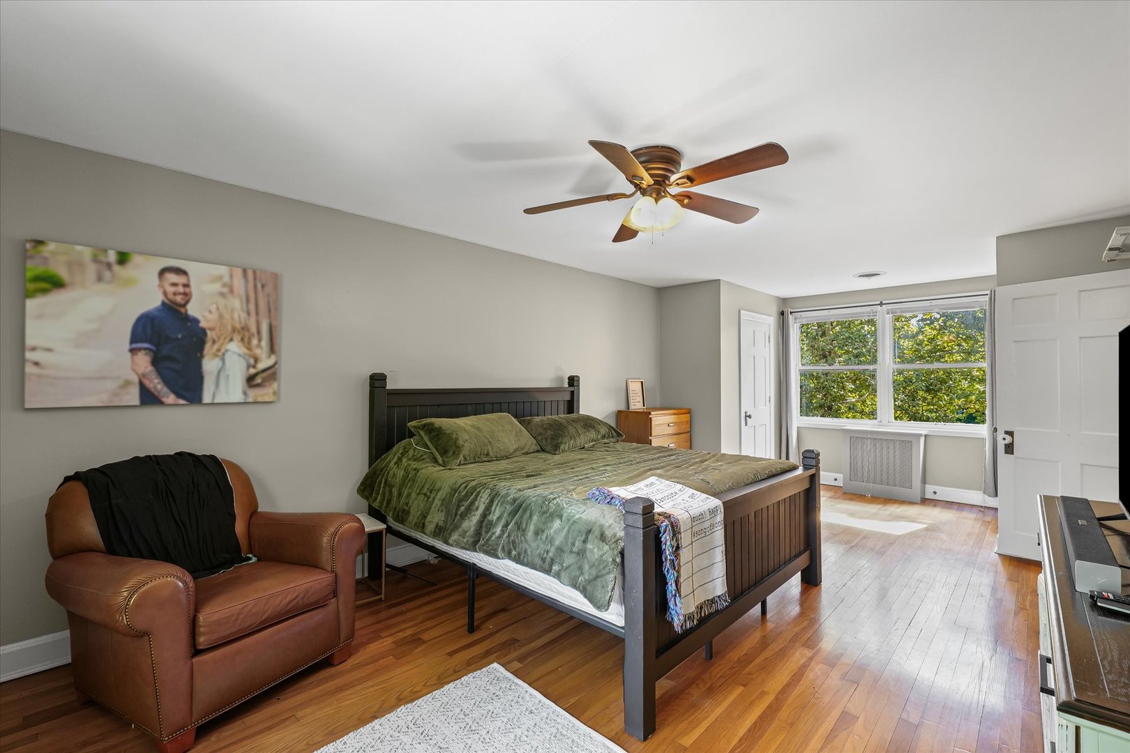 824 Arends Boulevard Rantoul, IL 61866 - Photo 24 of 38 a bedroom with a bed couch and a window