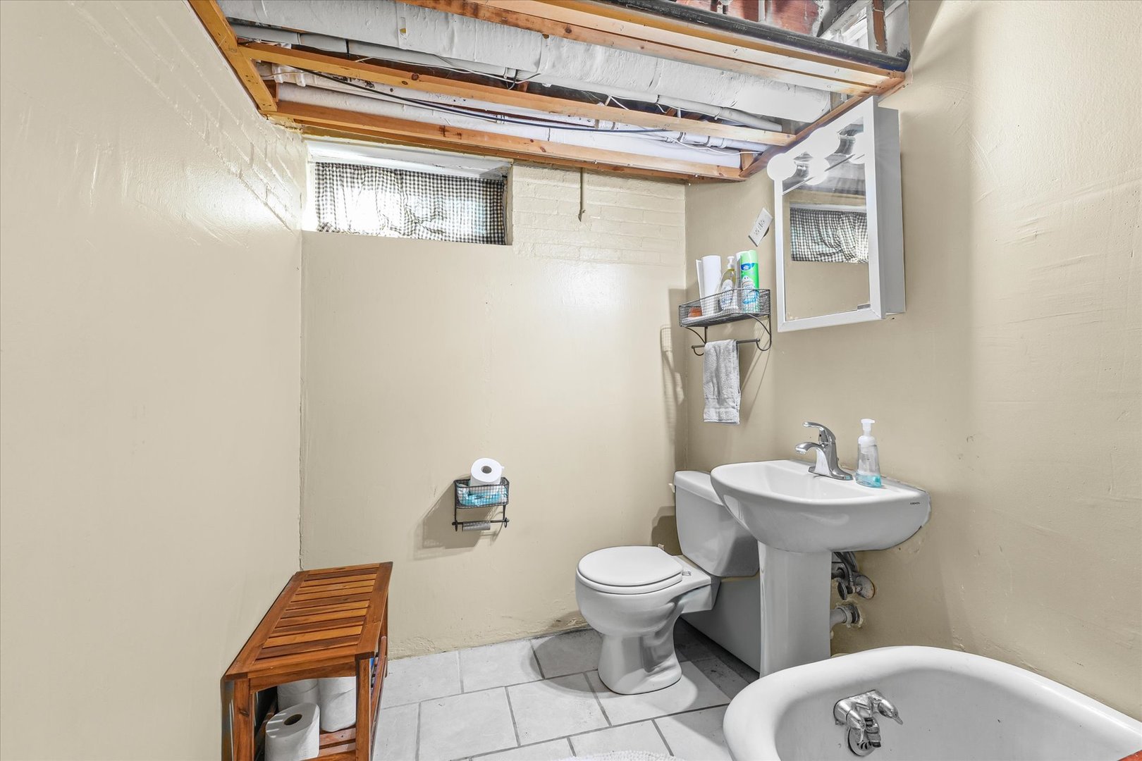 824 Arends Boulevard Rantoul, IL 61866 - Photo 31 of 38 a bathroom with a toilet sink and mirror