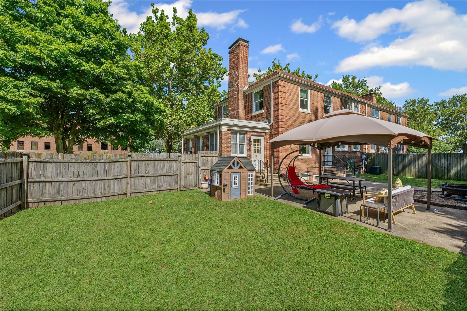 824 Arends Boulevard Rantoul, IL 61866 - Photo 35 of 38 a view of a house with a yard and sitting area