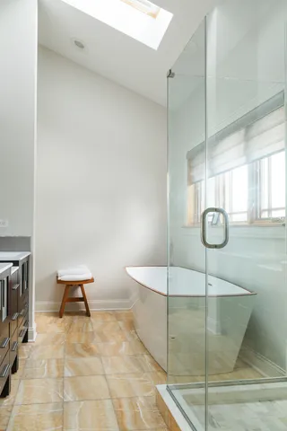 a bathroom with a shower and a sink