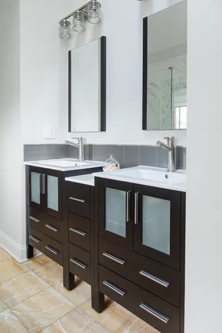 a bedroom with a bed and a mirror