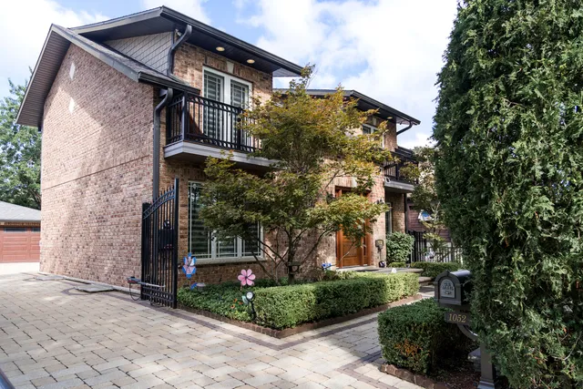 a view of a backyard with table and chairs and potted plants