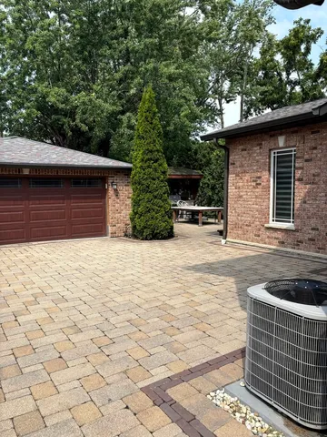 a view of a wooden deck and a yard