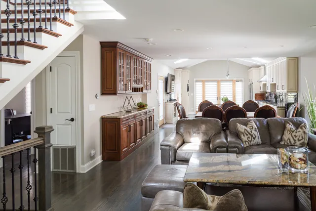 a living room with furniture fireplace and flat screen tv