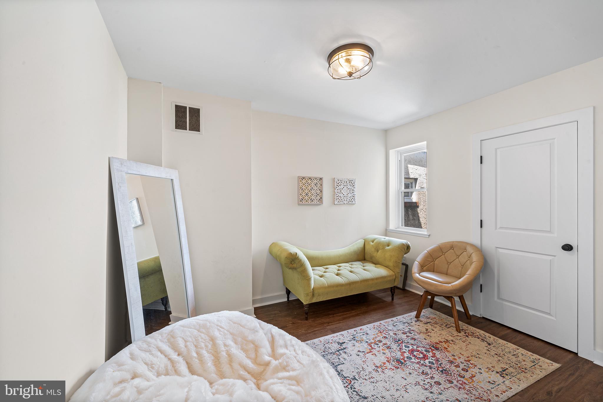 107 Master Street Philadelphia, PA 19122 - Photo 16 of 24 a bedroom with a bed and a window