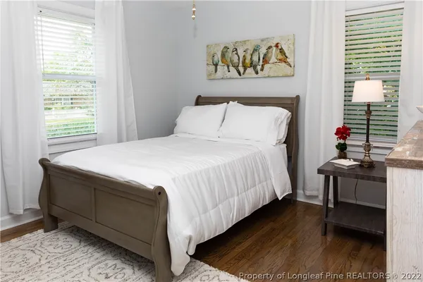 a bedroom with bed and a window