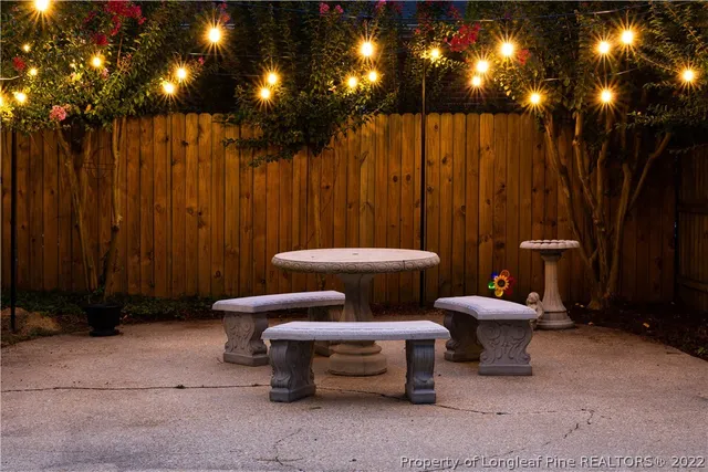 a bathroom with a toilet a sink and curtain