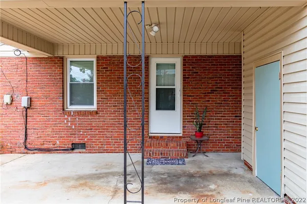 a view of a fence and flowers