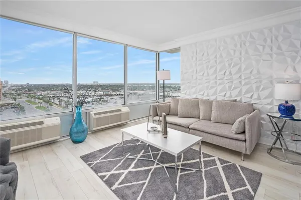 a living room with furniture and a view of living room