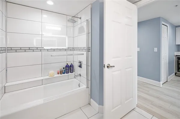 a bathroom with a bathtub and a shower