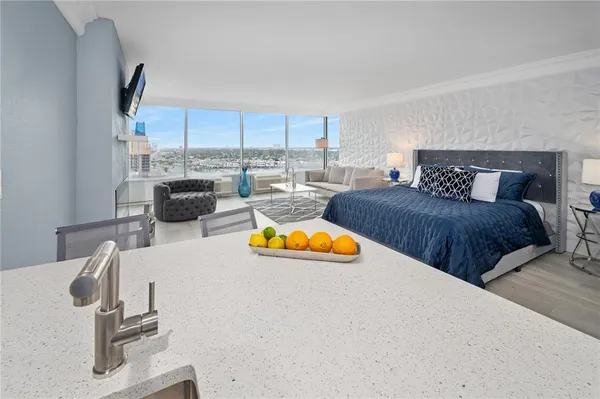 a view of a living room and kitchen