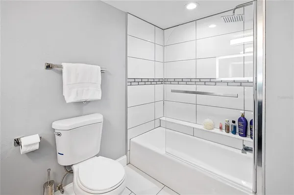 a bathroom with a toilet and a bathtub