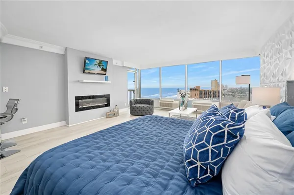 a living room with furniture a rug and white walls
