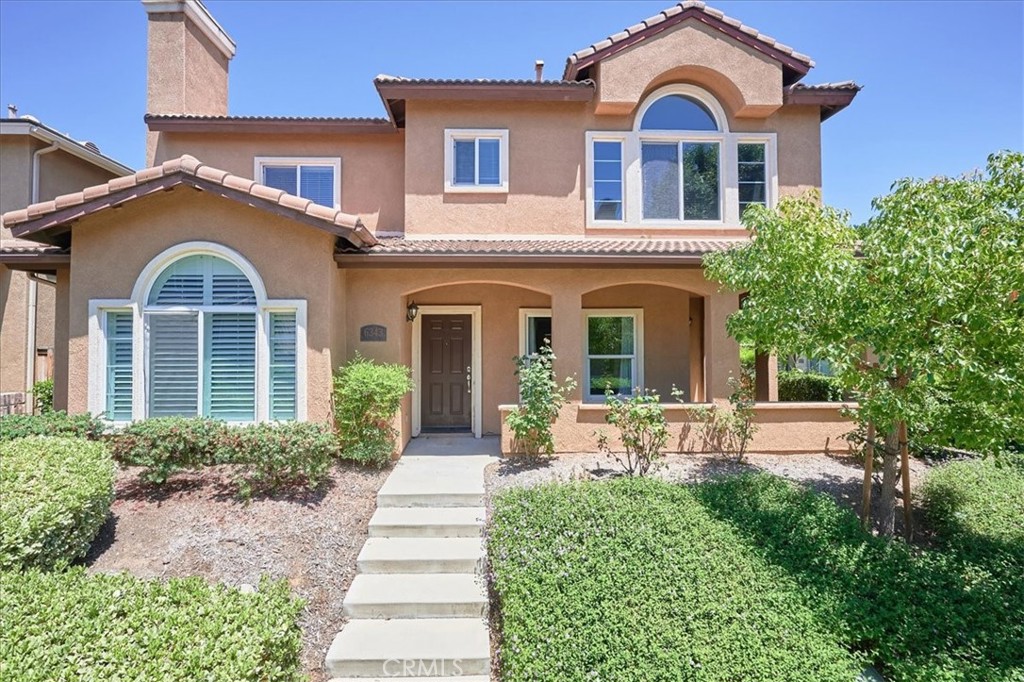6343 Sunfield Court Riverside, CA 92504 - Photo 1 of 1 a front view of a house with garden