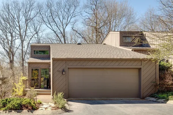 a front view of a house with garage