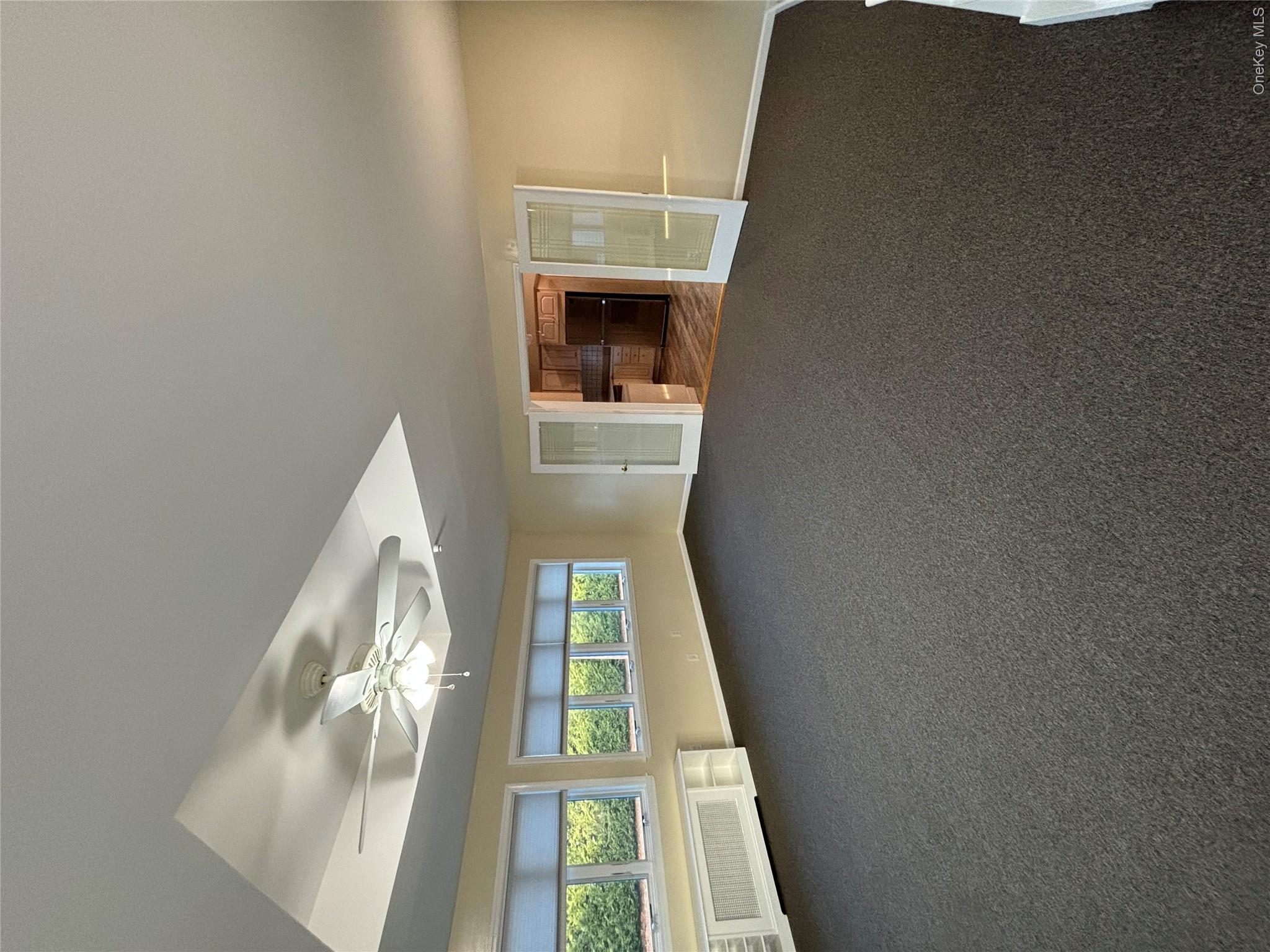 445 North Country Road St. James, NY 11780 - Photo 1 of 13 a view of an empty room with a window