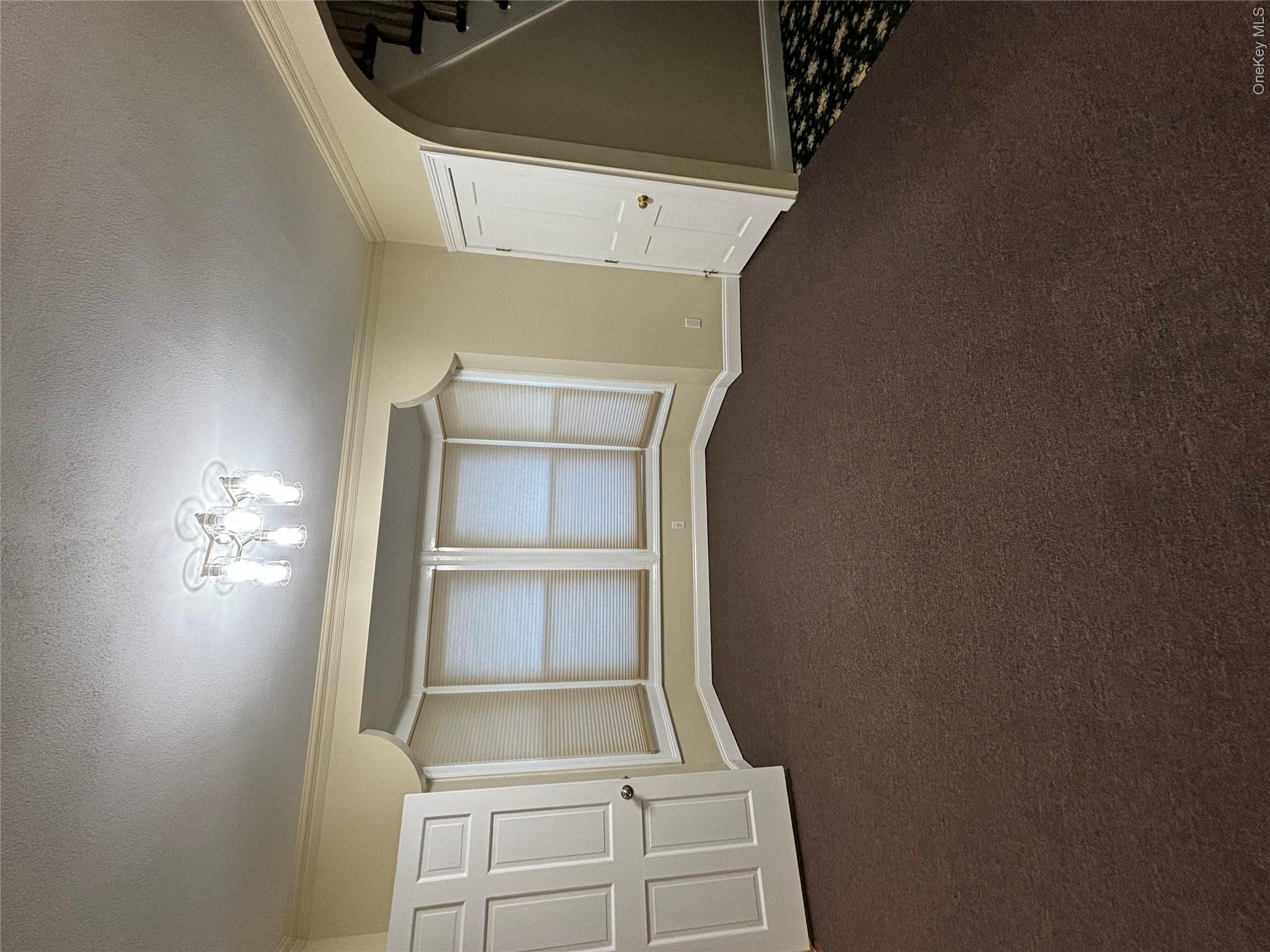 445 North Country Road St. James, NY 11780 - Photo 5 of 13 a view of an empty room with a window