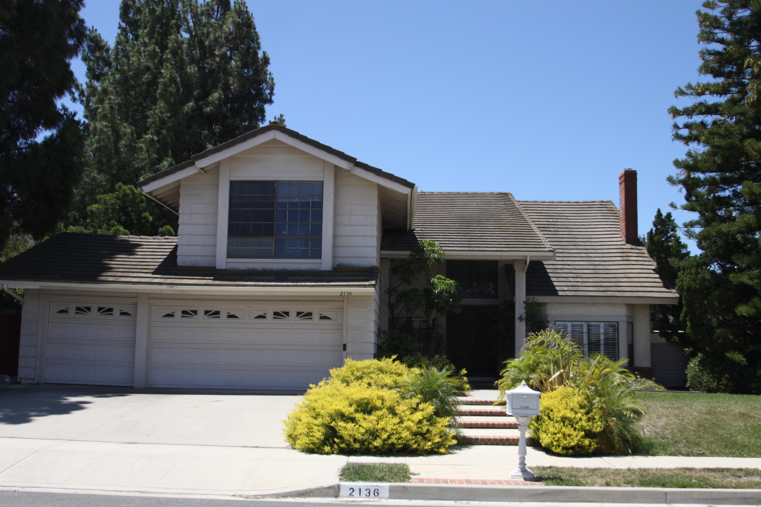 2136 McCrea Road Thousand Oaks, CA 91362 - Photo 1 of 26 a front view of house with yard
