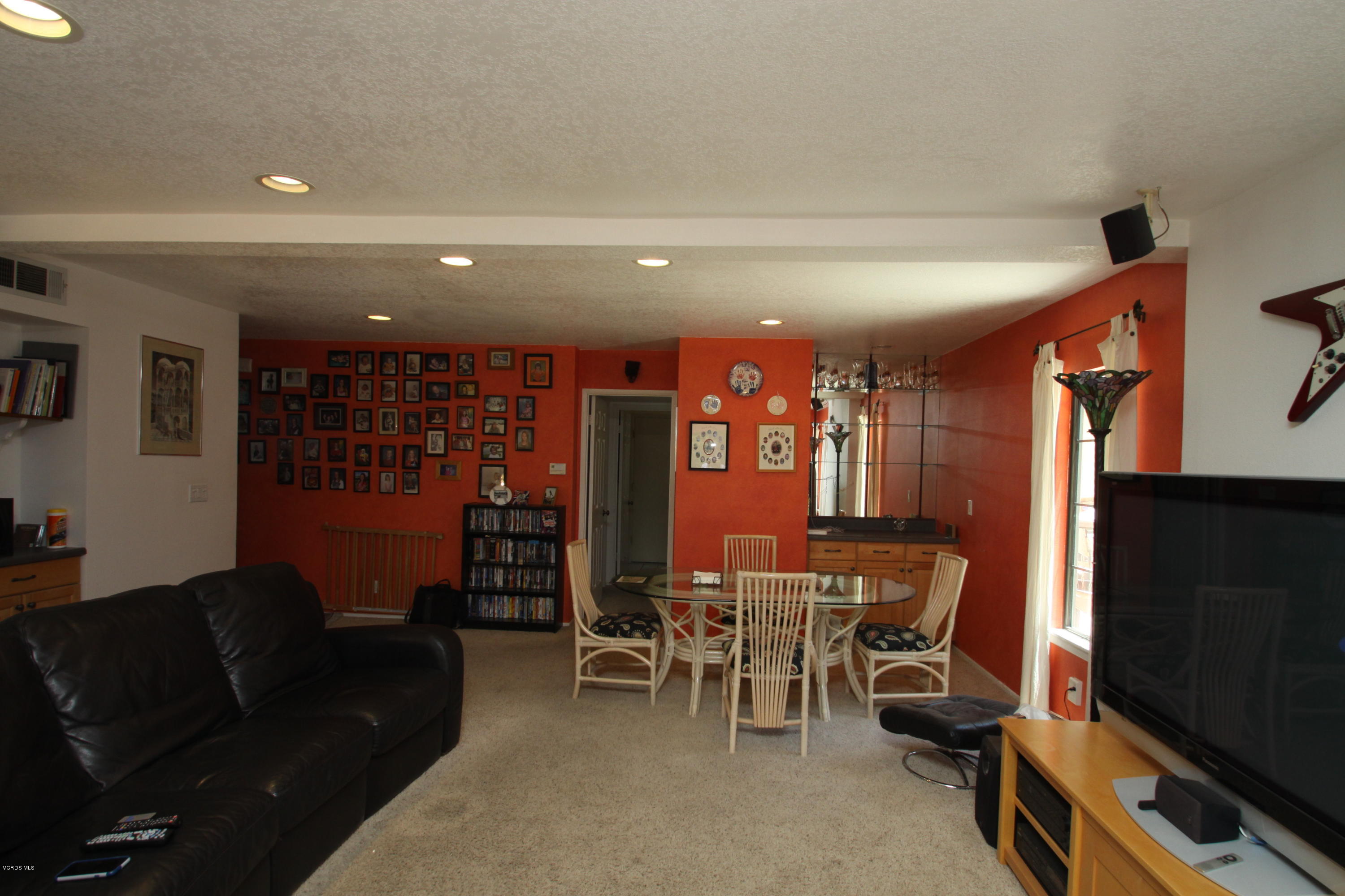 2136 McCrea Road Thousand Oaks, CA 91362 - Photo 14 of 26 a living room with furniture a lamp and a flat screen tv