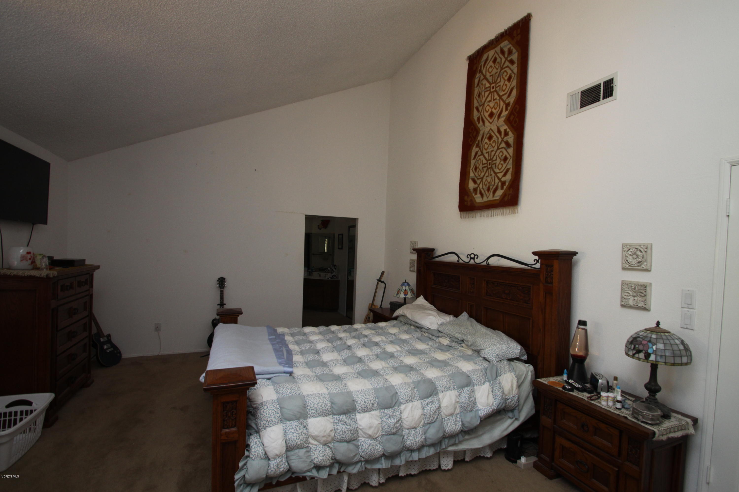 2136 McCrea Road Thousand Oaks, CA 91362 - Photo 17 of 26 a bedroom with a bed and wooden floor