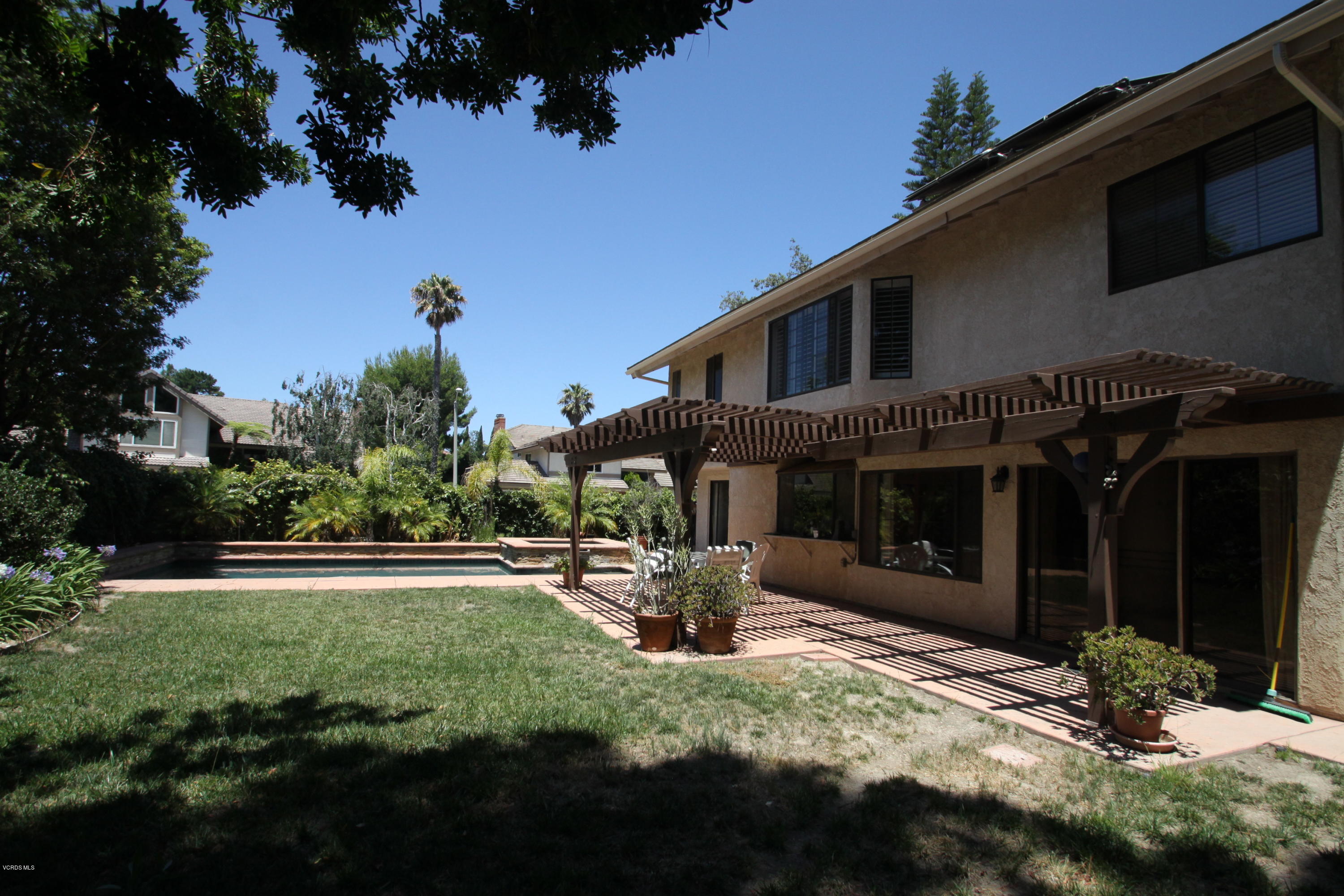 2136 McCrea Road Thousand Oaks, CA 91362 - Photo 25 of 26 a front view of a house with a yard