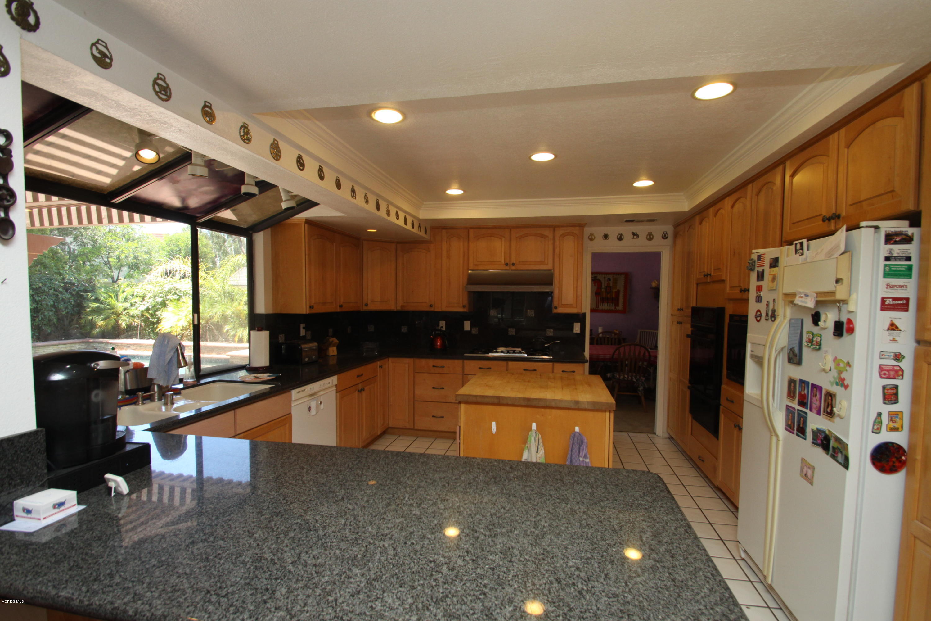 2136 McCrea Road Thousand Oaks, CA 91362 - Photo 6 of 26 a kitchen with stainless steel appliances granite countertop a sink and a refrigerator