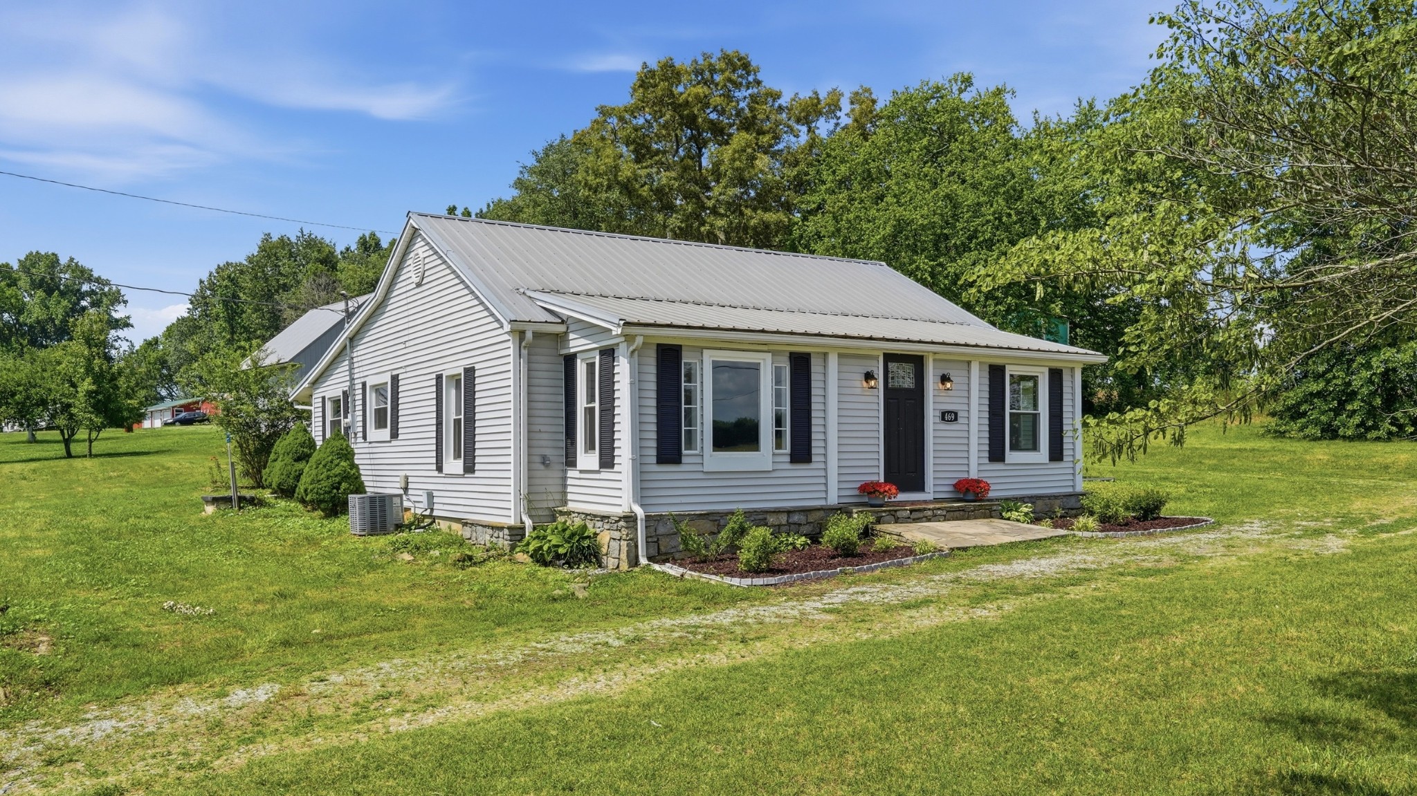 469 Fred Cooper Road McMinnville, TN 37110 - Photo 4 of 46 a front view of a house with a yard