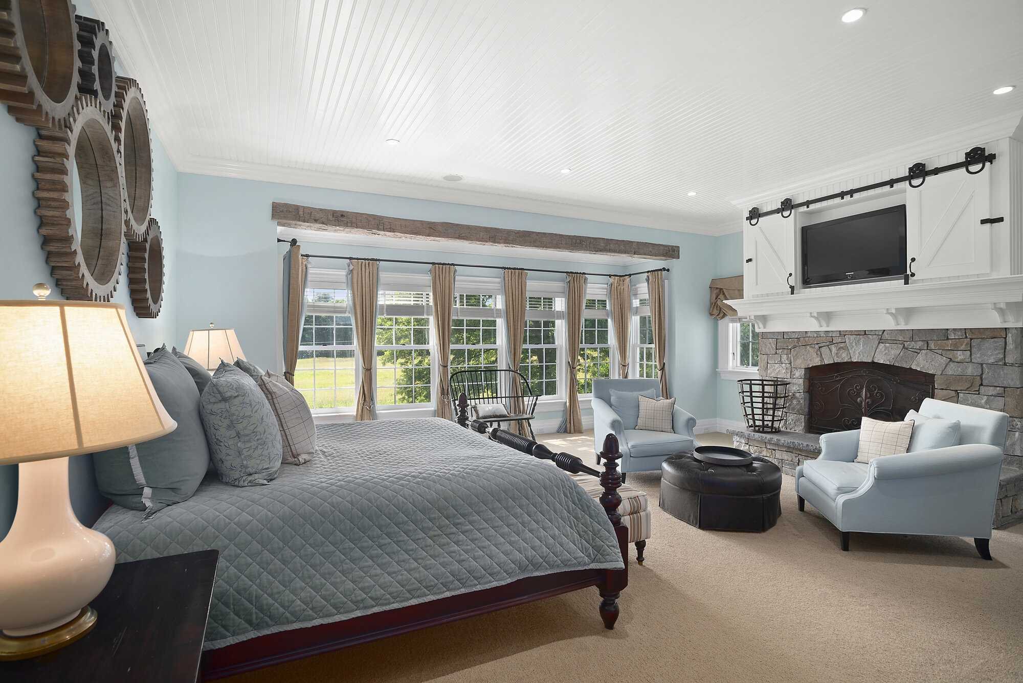 140 Sunset Trail Clinton, NY 12514 - Photo 18 of 30 a spacious bedroom with a bed and a fireplace