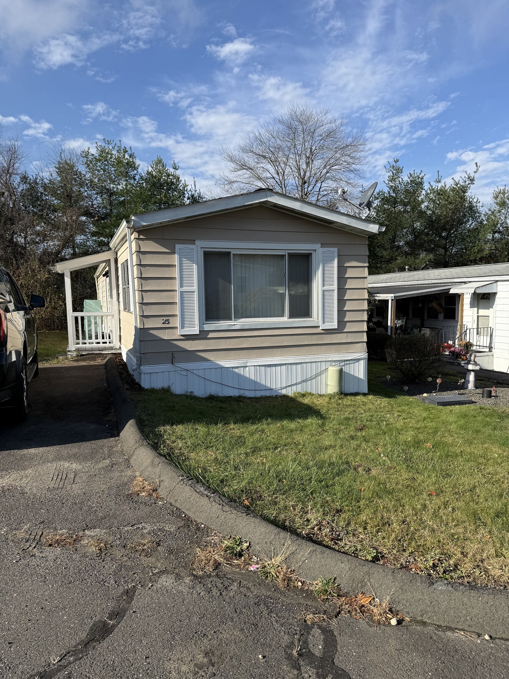 23 Thunderbird Drive Naugatuck, CT 06770 - Photo 2 of 19 a front view of a house with a yard
