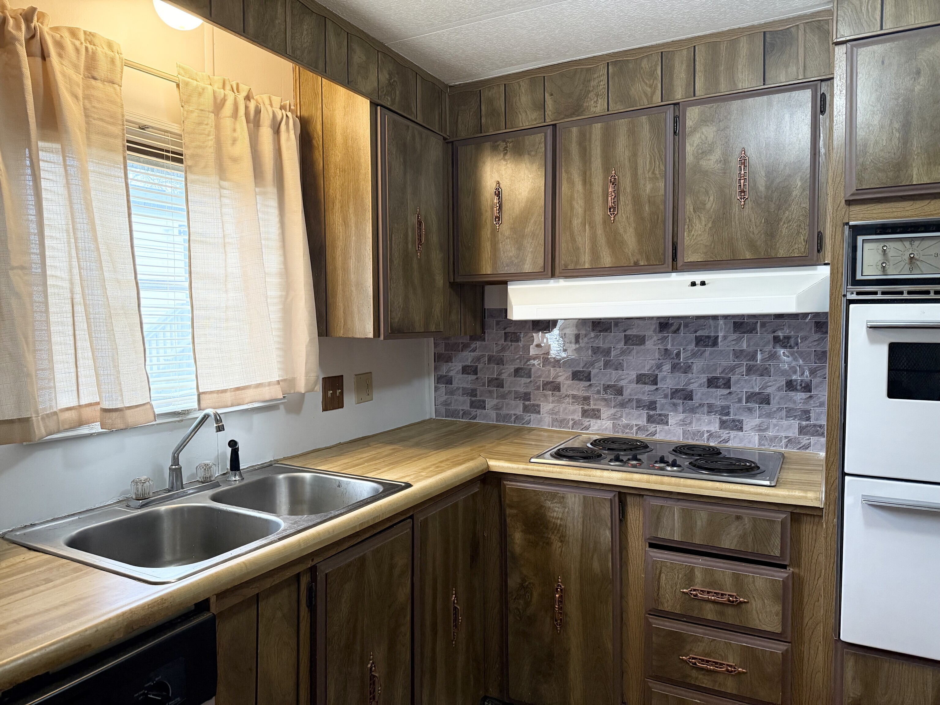 23 Thunderbird Drive Naugatuck, CT 06770 - Photo 3 of 19 a kitchen with a sink and a refrigerator