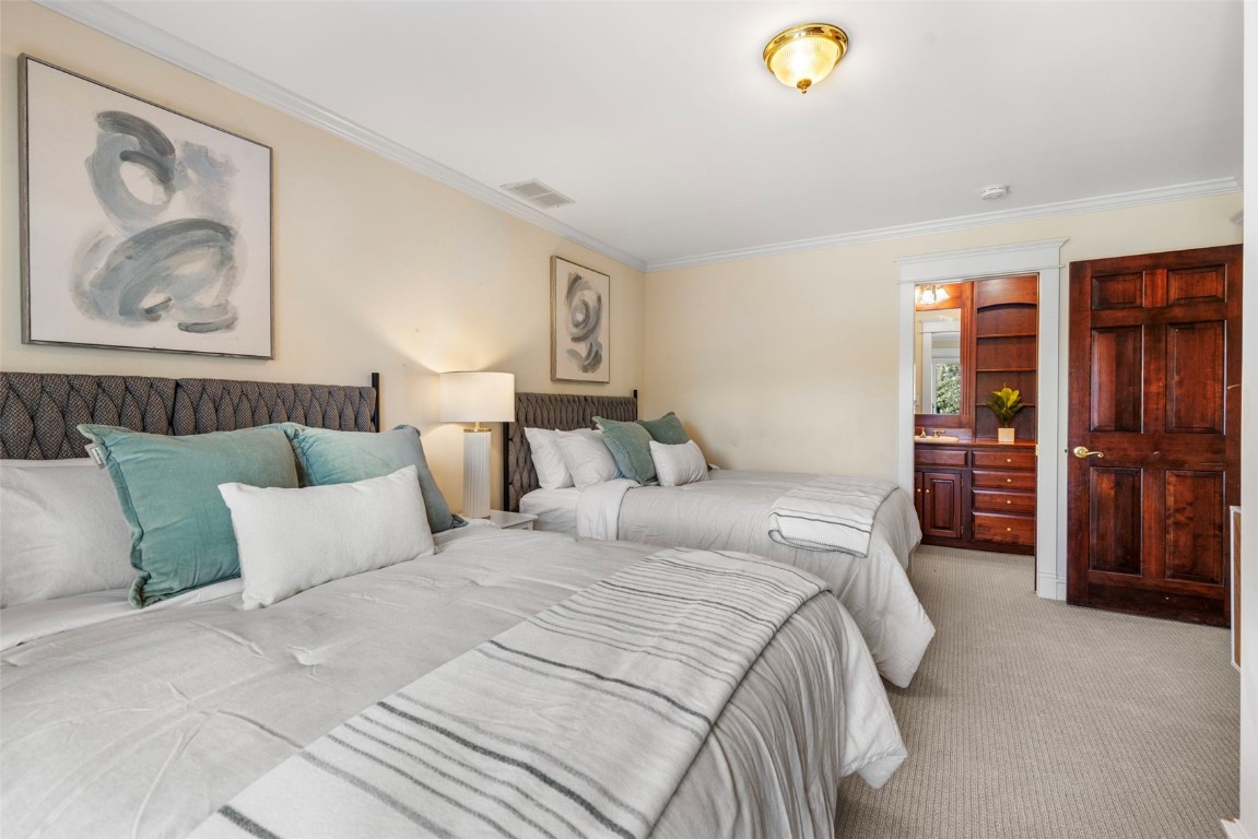 192 Wellington Road Breckenridge, CO 80424 - Photo 16 of 50 Carpeted bedroom with ornamental molding and connected bathroom