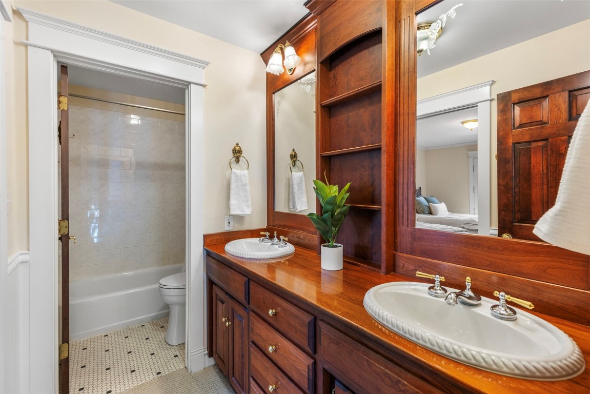 192 Wellington Road Breckenridge, CO 80424 - Photo 17 of 50 Bathroom with double vanity, light tile patterned floors, and shower / washtub combination