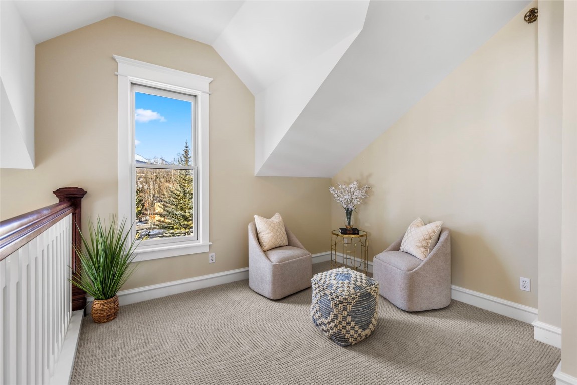 192 Wellington Road Breckenridge, CO 80424 - Photo 20 of 50 Living area with carpet and vaulted ceiling