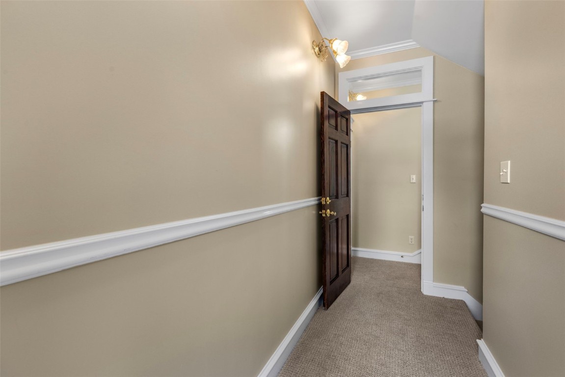 192 Wellington Road Breckenridge, CO 80424 - Photo 31 of 50 Corridor with light carpet and crown molding
