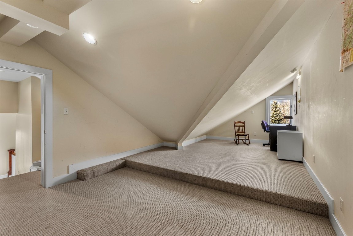 192 Wellington Road Breckenridge, CO 80424 - Photo 33 of 50 Additional living space with carpet and vaulted ceiling