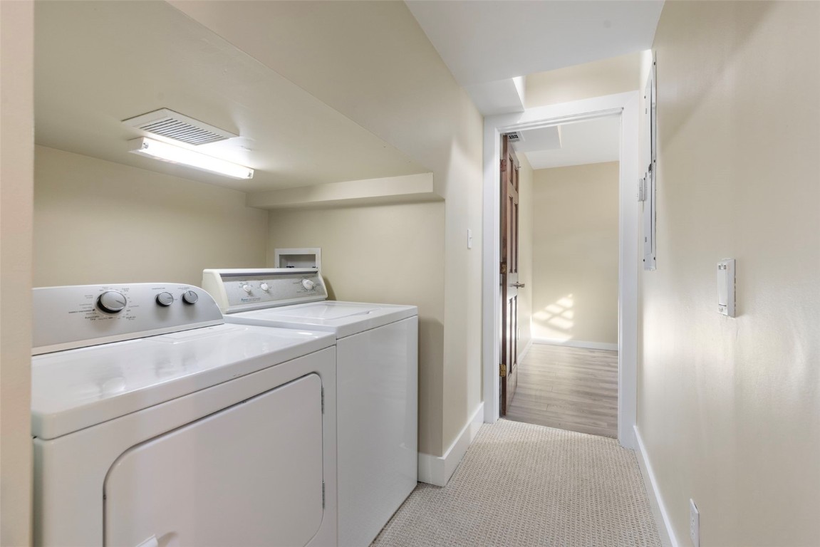 192 Wellington Road Breckenridge, CO 80424 - Photo 40 of 50 Laundry area with baseboards and washing machine and dryer