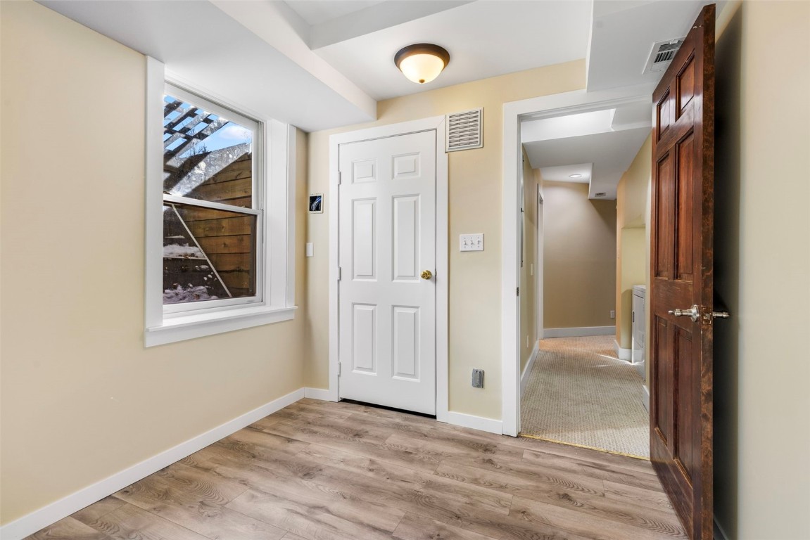 192 Wellington Road Breckenridge, CO 80424 - Photo 42 of 50 Entryway with baseboards and light wood finished floors