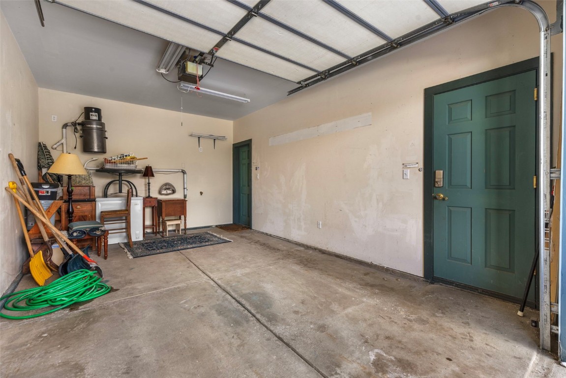 192 Wellington Road Breckenridge, CO 80424 - Photo 44 of 50 Garage with a garage door opener and a central vacuum unit