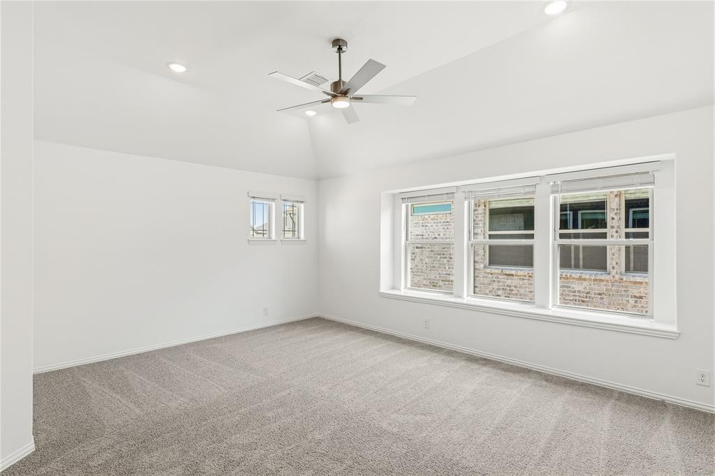 1145 Hitching Post Way Oak Point, TX 75068 - Photo 30 of 39 a view of an empty room with a window