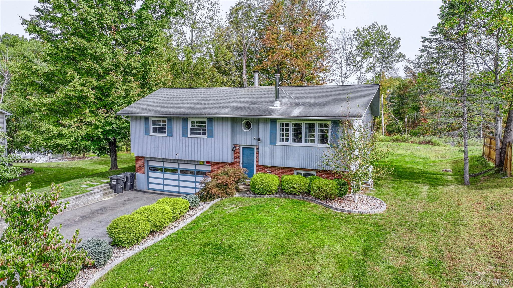 29 Cornfield Road Middletown, NY 10940 - Photo 1 of 1 a view of a house with a yard and a large tree