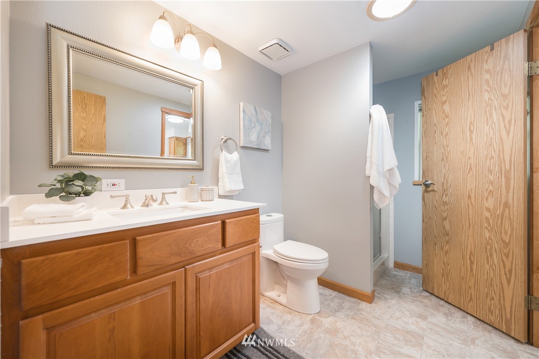 24121 10th Place West Bothell, WA 98021 - Photo 22 of 30 a bathroom with a sink a toilet and shower
