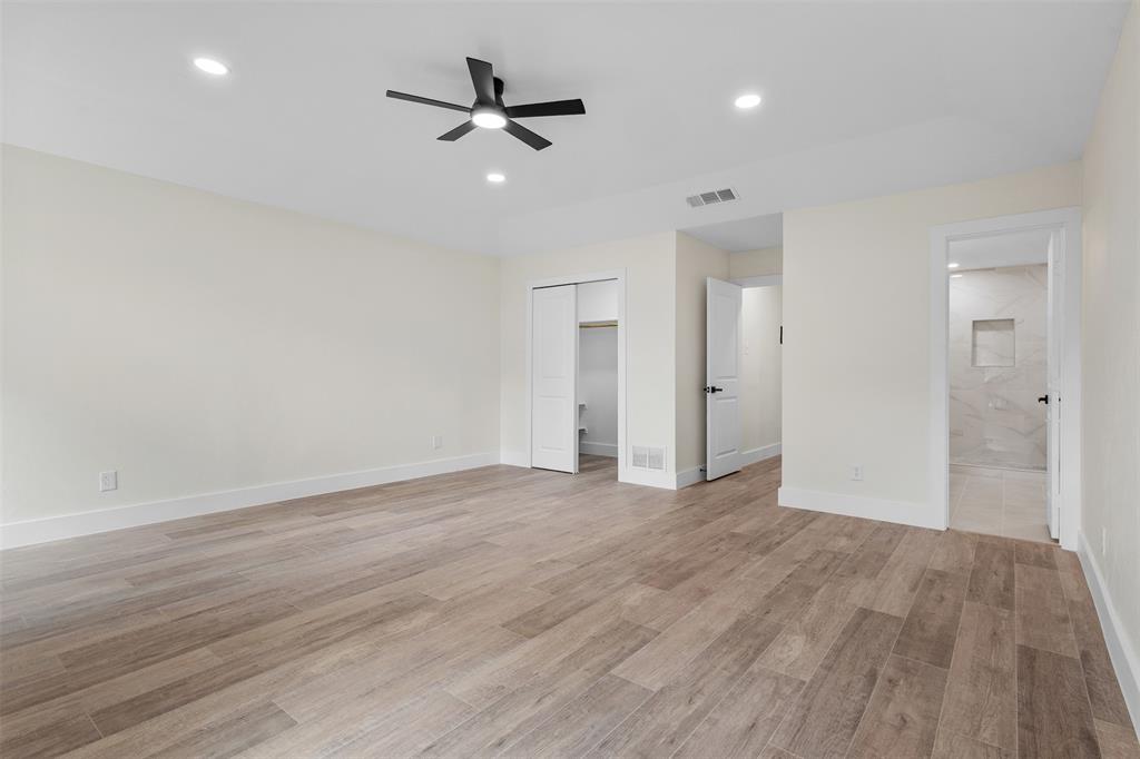 2816 Quail Ridge Drive Carrollton, TX 75006 - Photo 13 of 33 Unfurnished bedroom with light wood-style floors, recessed lighting, a ceiling fan, and connected bathroom