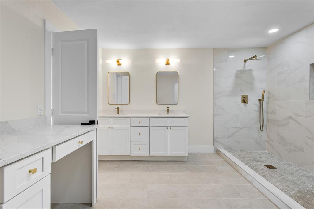 2816 Quail Ridge Drive Carrollton, TX 75006 - Photo 15 of 33 Full bath featuring a marble finish shower, double vanity, recessed lighting, and light tile patterned floors