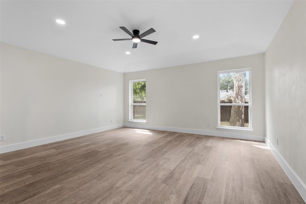 2816 Quail Ridge Drive Carrollton, TX 75006 - Photo 16 of 33 Unfurnished room featuring recessed lighting, light wood-type flooring, and a ceiling fan