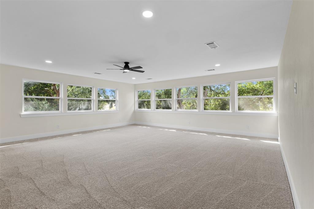 2816 Quail Ridge Drive Carrollton, TX 75006 - Photo 23 of 33 Empty room featuring light colored carpet, plenty of natural light, recessed lighting, and ceiling fan